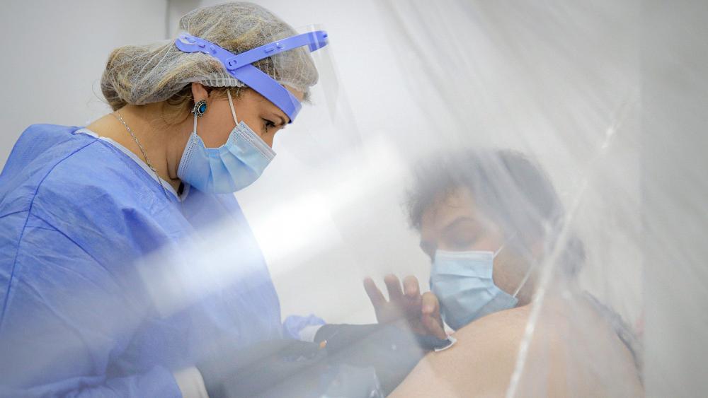 Getting COVID-19 jabs to world’s hardest-to-reach people is a monumental task | View