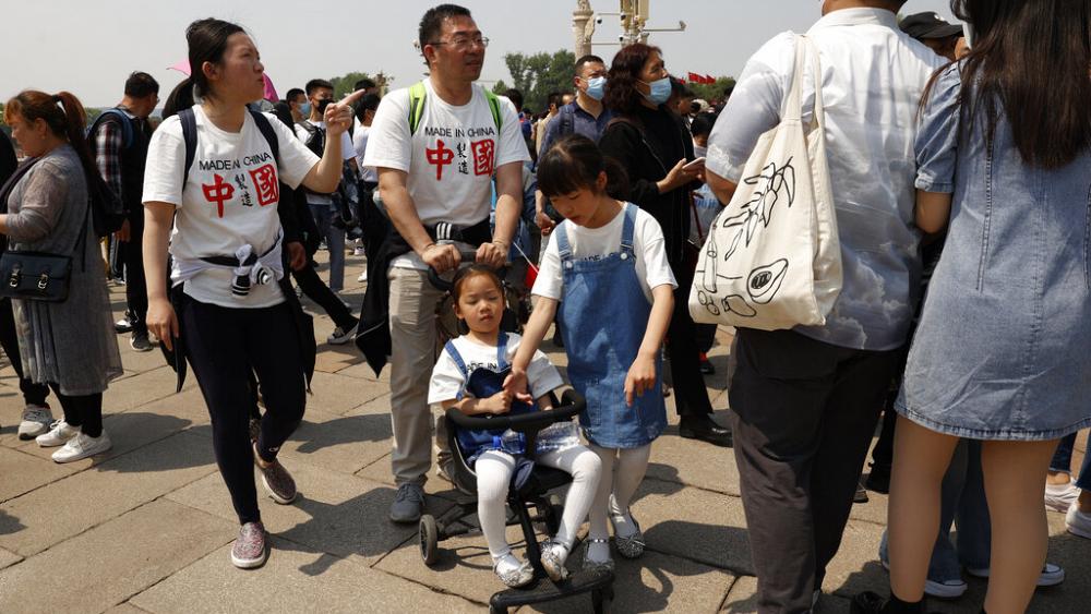 China's population growth rate close to zero as fewer couples have children